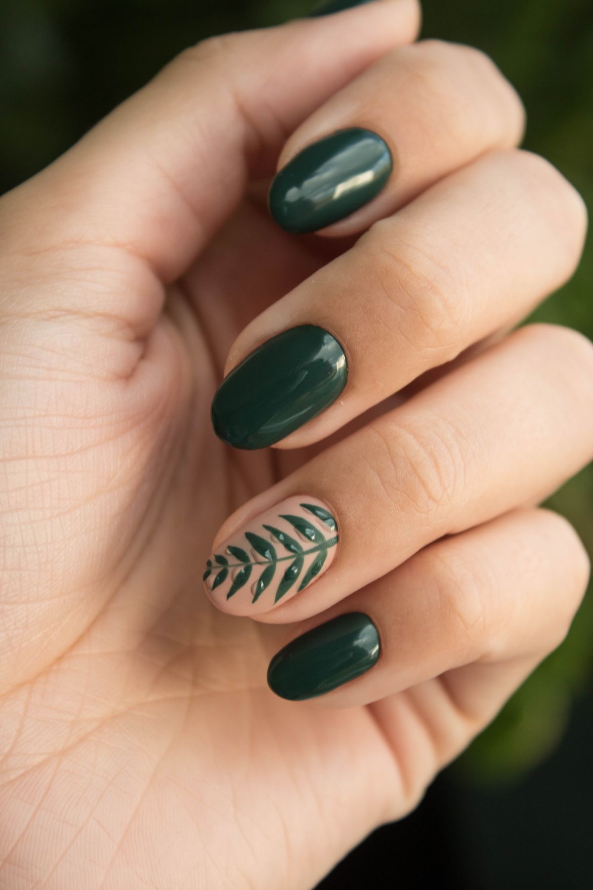 Structure gel manicure with hand-painted leaf accent at Eastside Nails